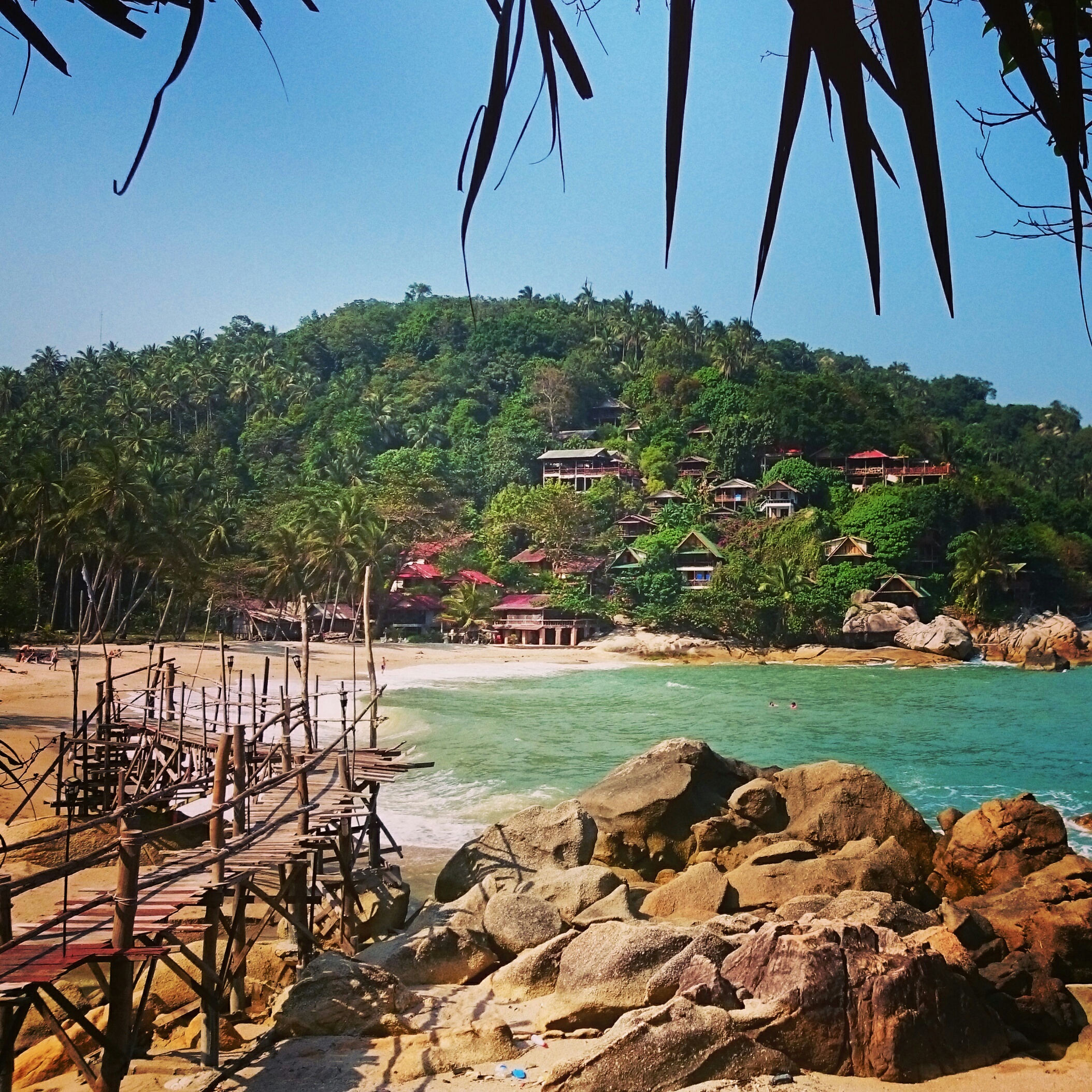 rock-formation-with-bridge-tourist-background